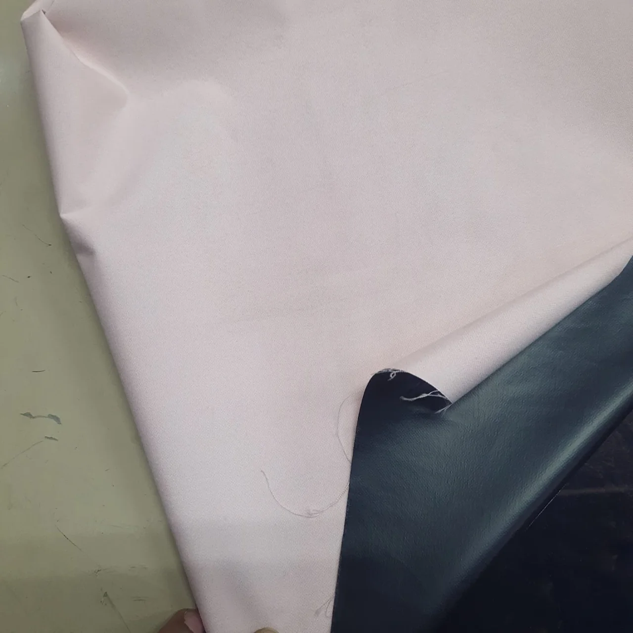 Light curtain fabric with dark backing